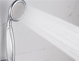 What should I do if the shower head at home is blocked?