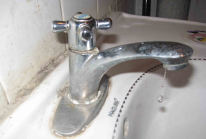 How can you fix the dripping water when the tap is off